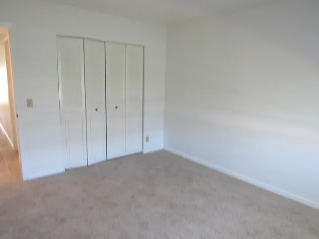 a view of an empty room and entryway