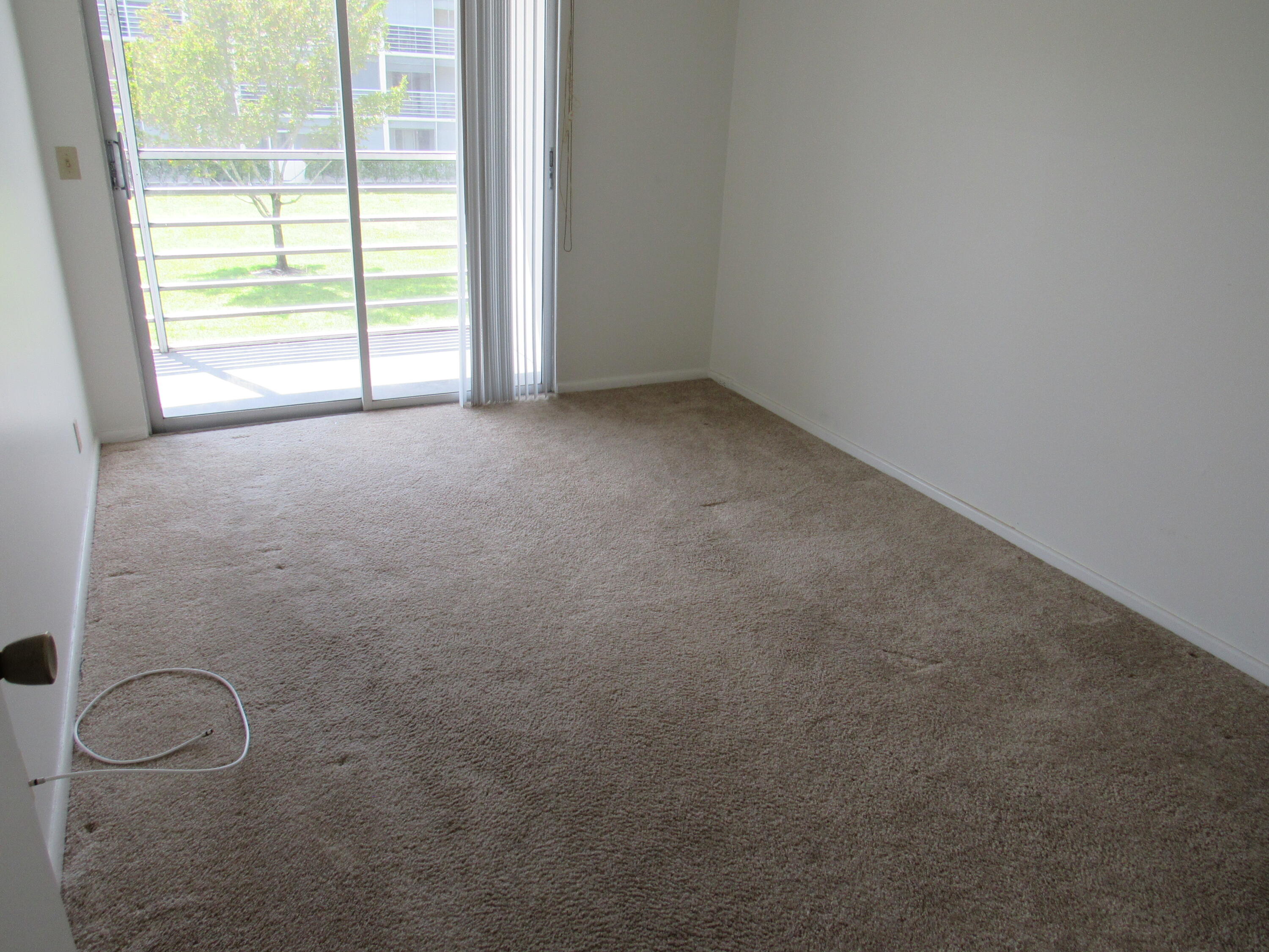 310 Brighton H Boca Raton, FL 33434 - Photo 20 of 41 a view of an empty room with a window
