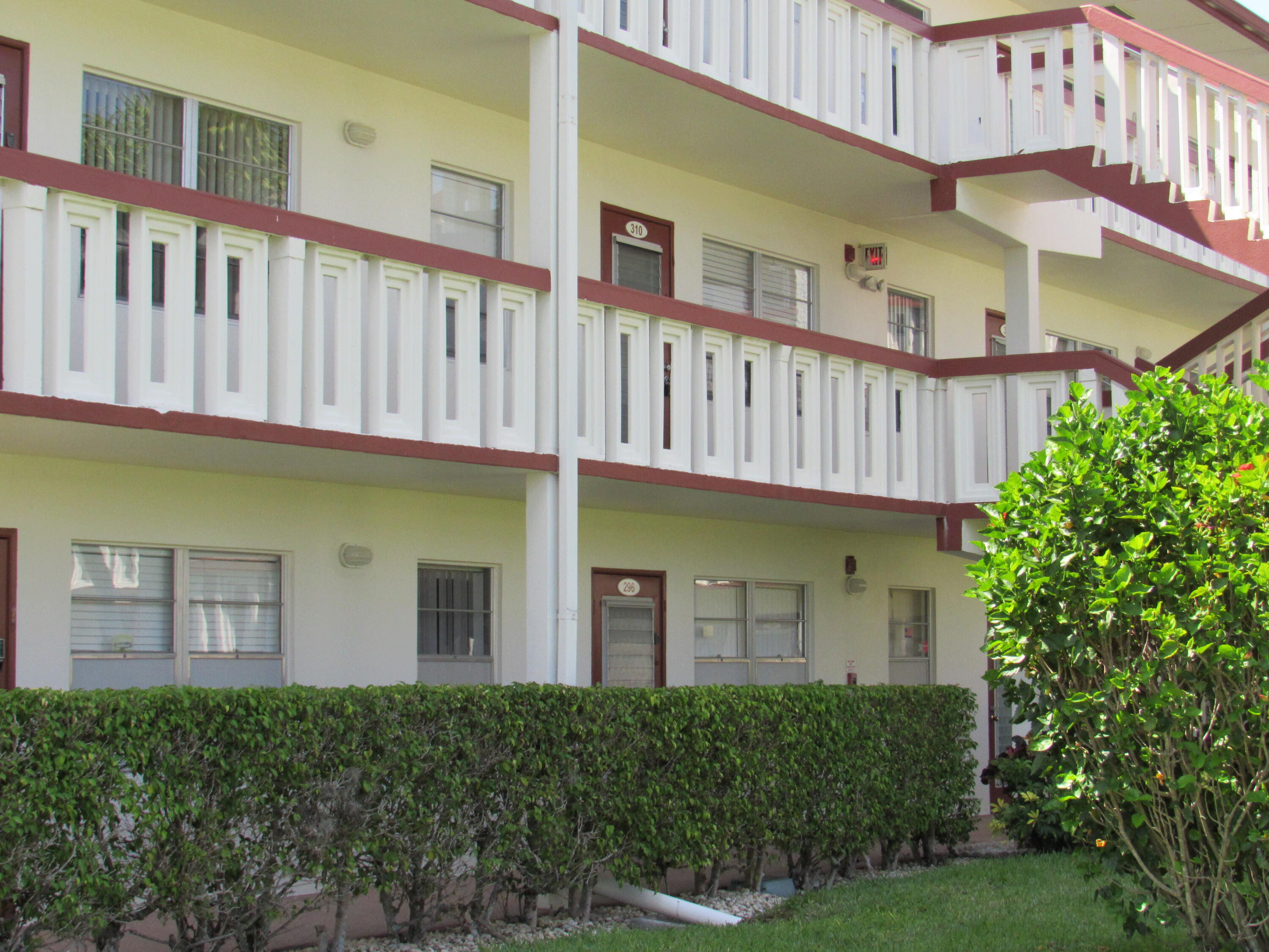 310 Brighton H Boca Raton, FL 33434 - Photo 28 of 41 a front view of a house with balcony