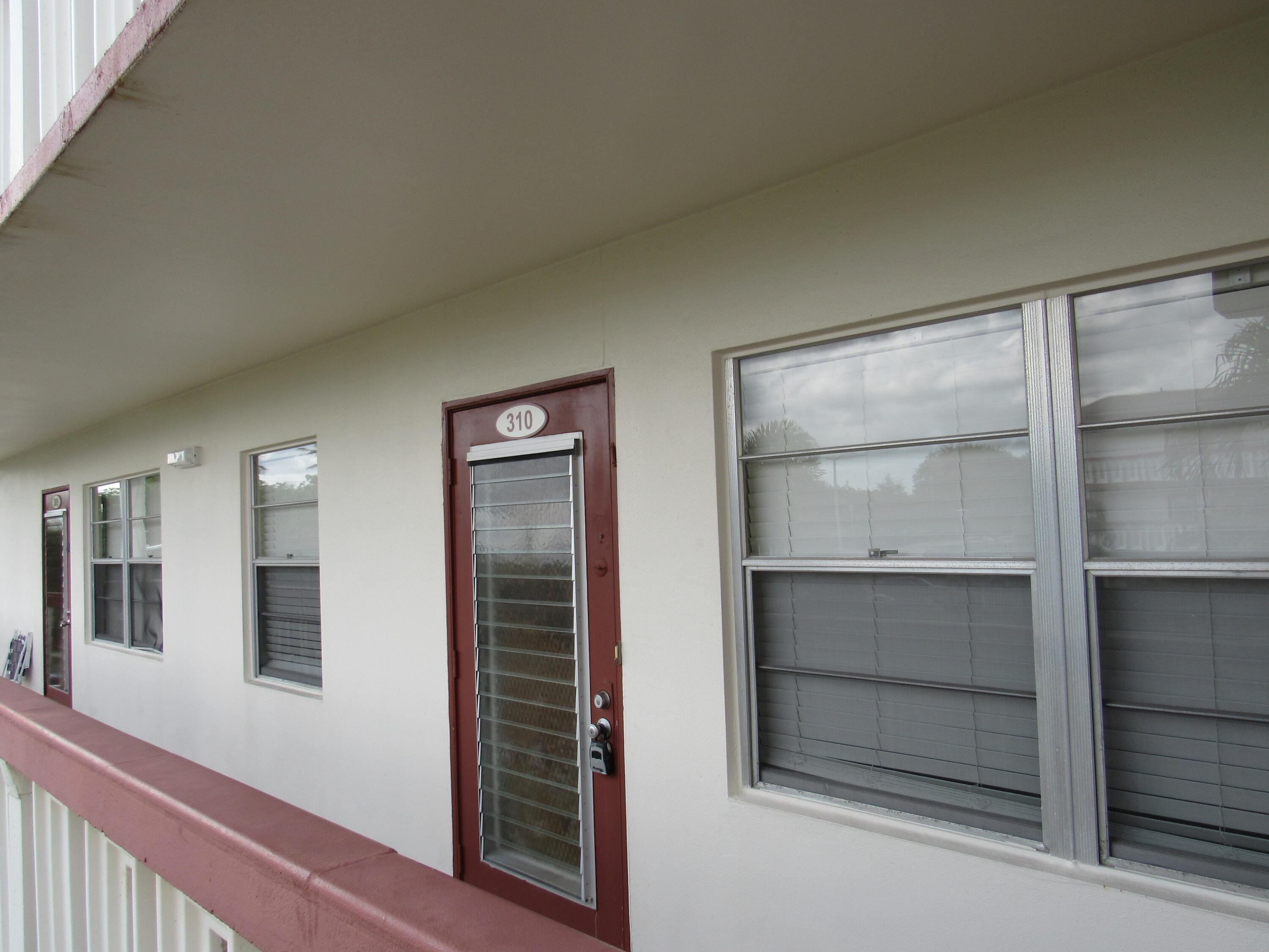 310 Brighton H Boca Raton, FL 33434 - Photo 6 of 41 a view of walk in closet with empty racks