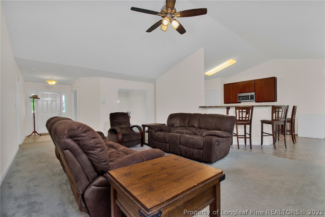 166 Hayden Road Fairmont, NC 28340 - Photo 12 of 37 a living room with furniture and a flat screen tv