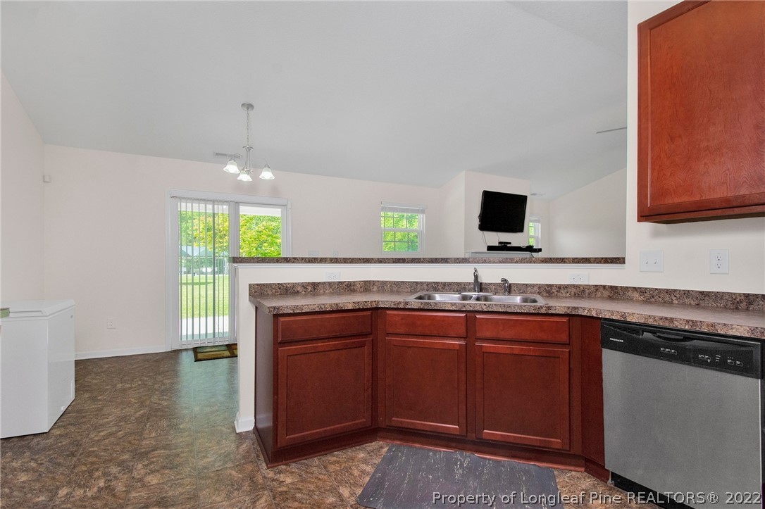 166 Hayden Road Fairmont, NC 28340 - Photo 16 of 37 a kitchen with a sink and a stove top oven