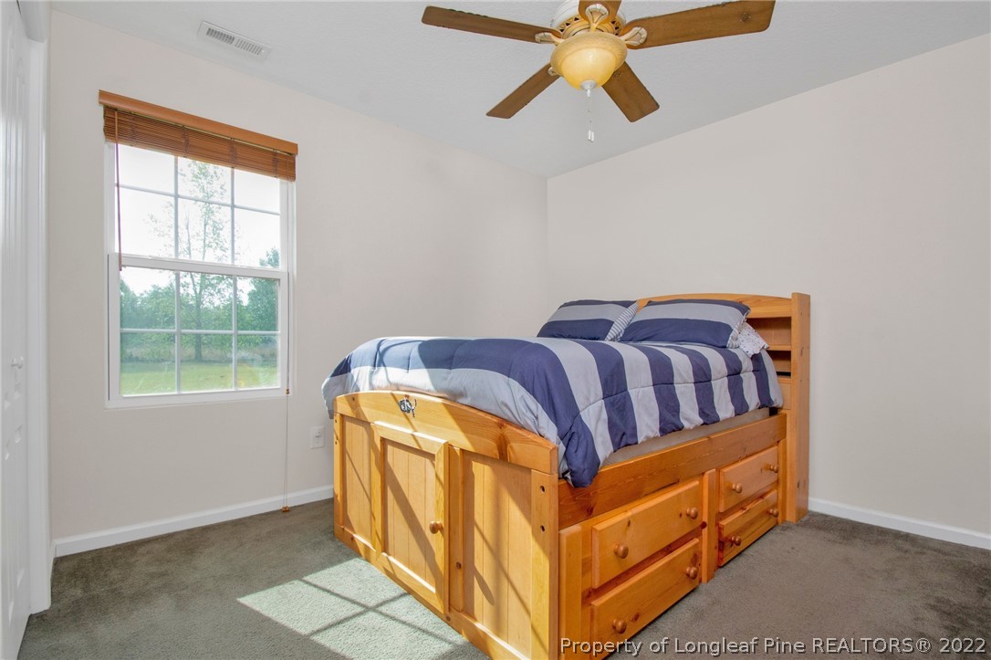 166 Hayden Road Fairmont, NC 28340 - Photo 19 of 37 a bedroom with a bed and window
