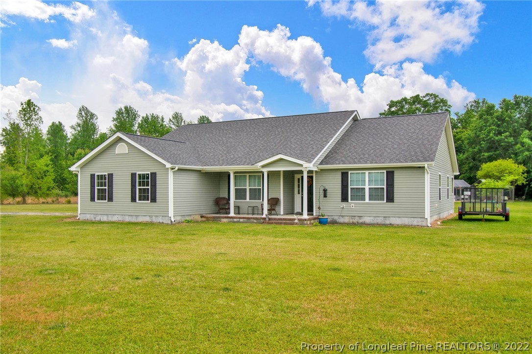 166 Hayden Road Fairmont, NC 28340 - Photo 2 of 37 a view of a house with swimming pool and a yard