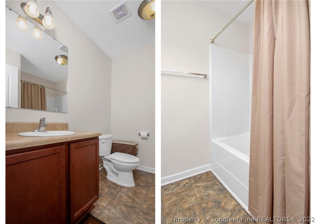 166 Hayden Road Fairmont, NC 28340 - Photo 23 of 37 a bathroom with a granite countertop sink mirror vanity and toilet