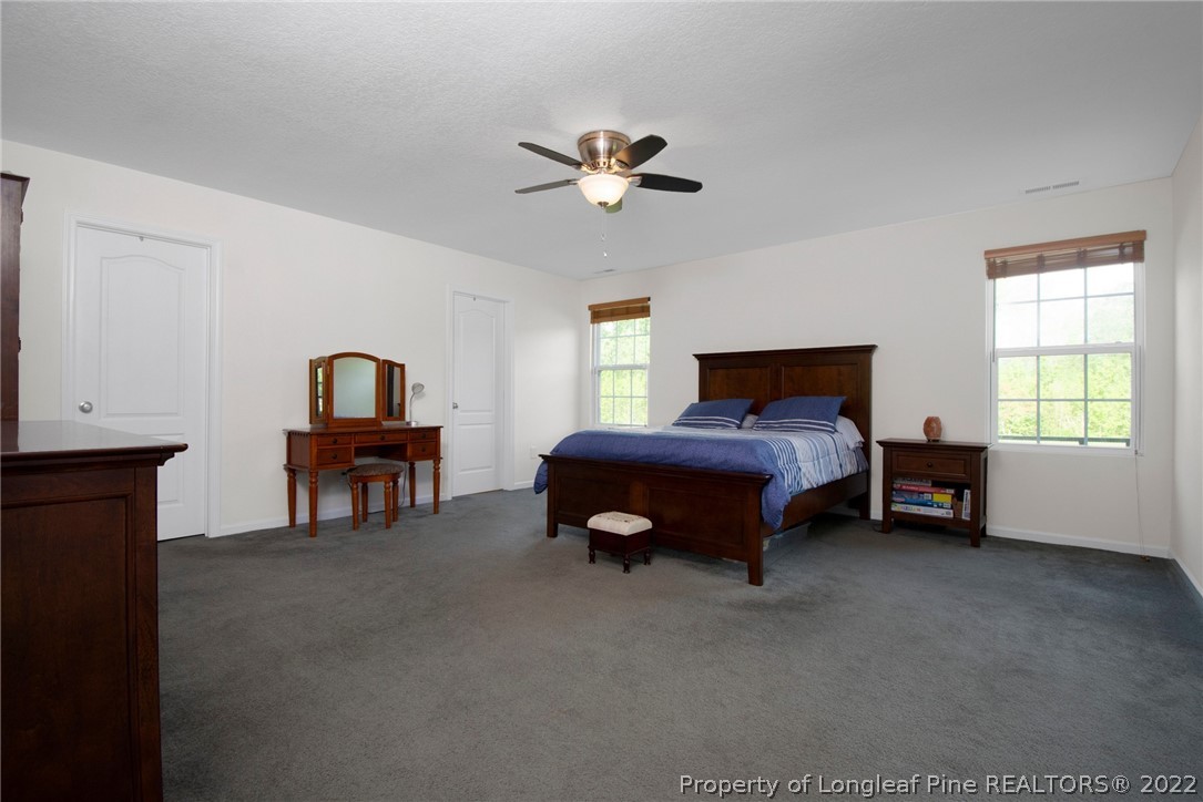 166 Hayden Road Fairmont, NC 28340 - Photo 25 of 37 a bedroom with furniture and a ceiling fan