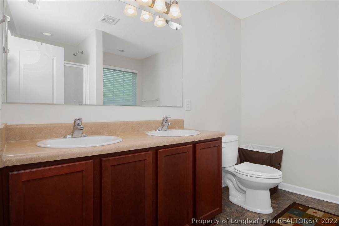 166 Hayden Road Fairmont, NC 28340 - Photo 28 of 37 a bathroom with a toilet sink and mirror