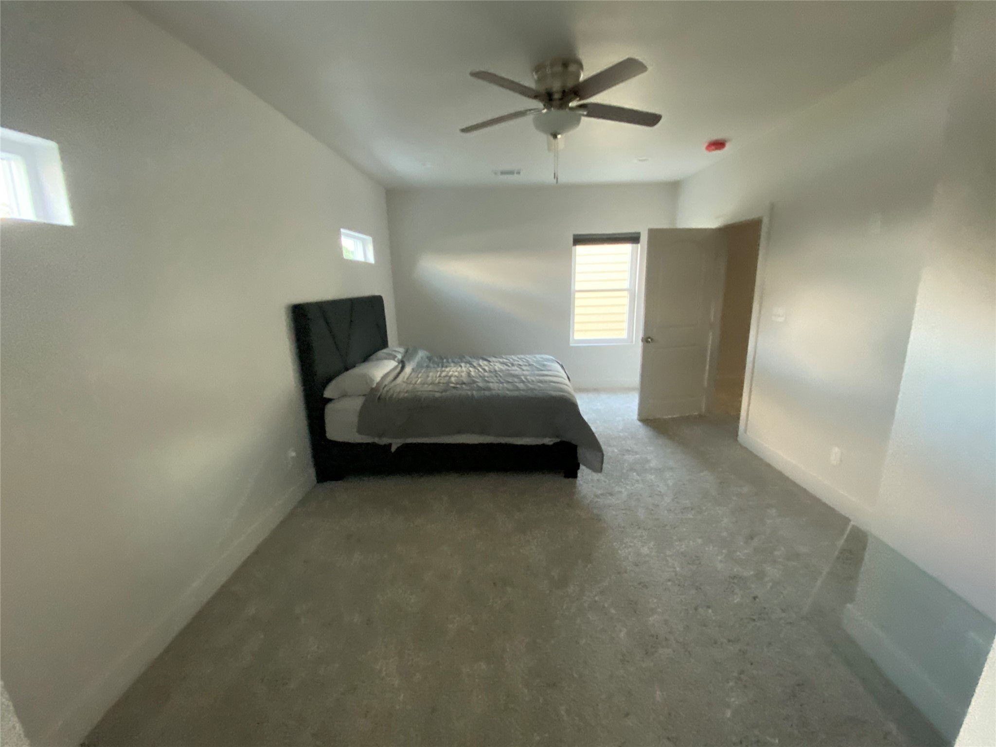 9737 Fabiola Drive Houston, TX 77075 - Photo 4 of 9 a spacious bedroom with a bed and a chandelier