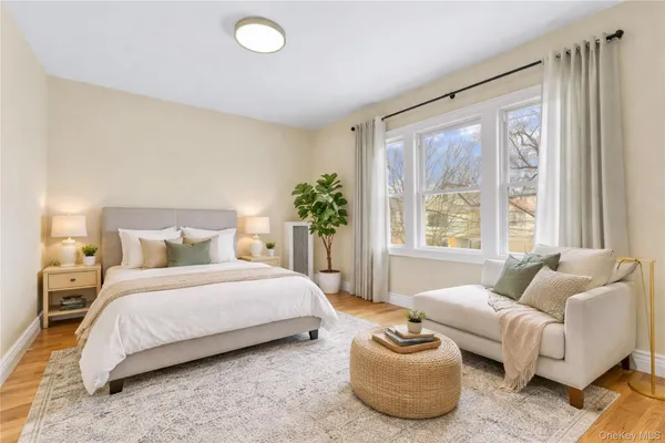 a bedroom with a bed and a couch