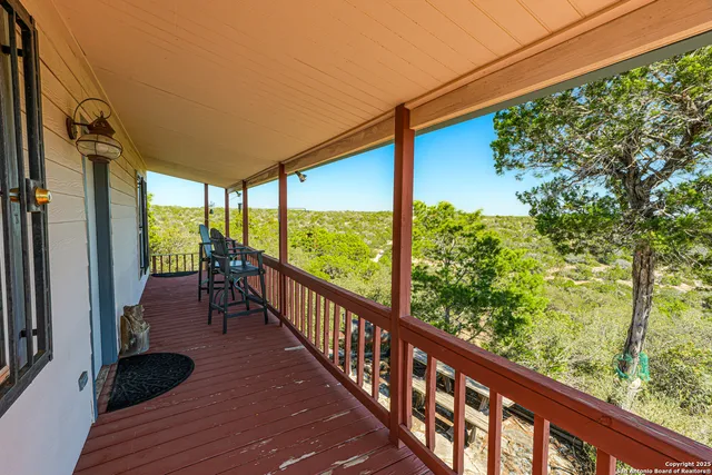 a view of balcony with furniture