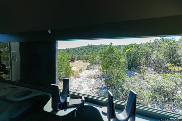 a view of balcony with furniture