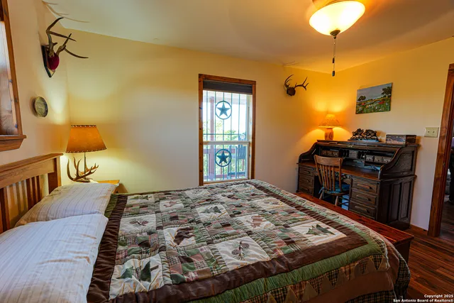 a bedroom with a bed and dresser