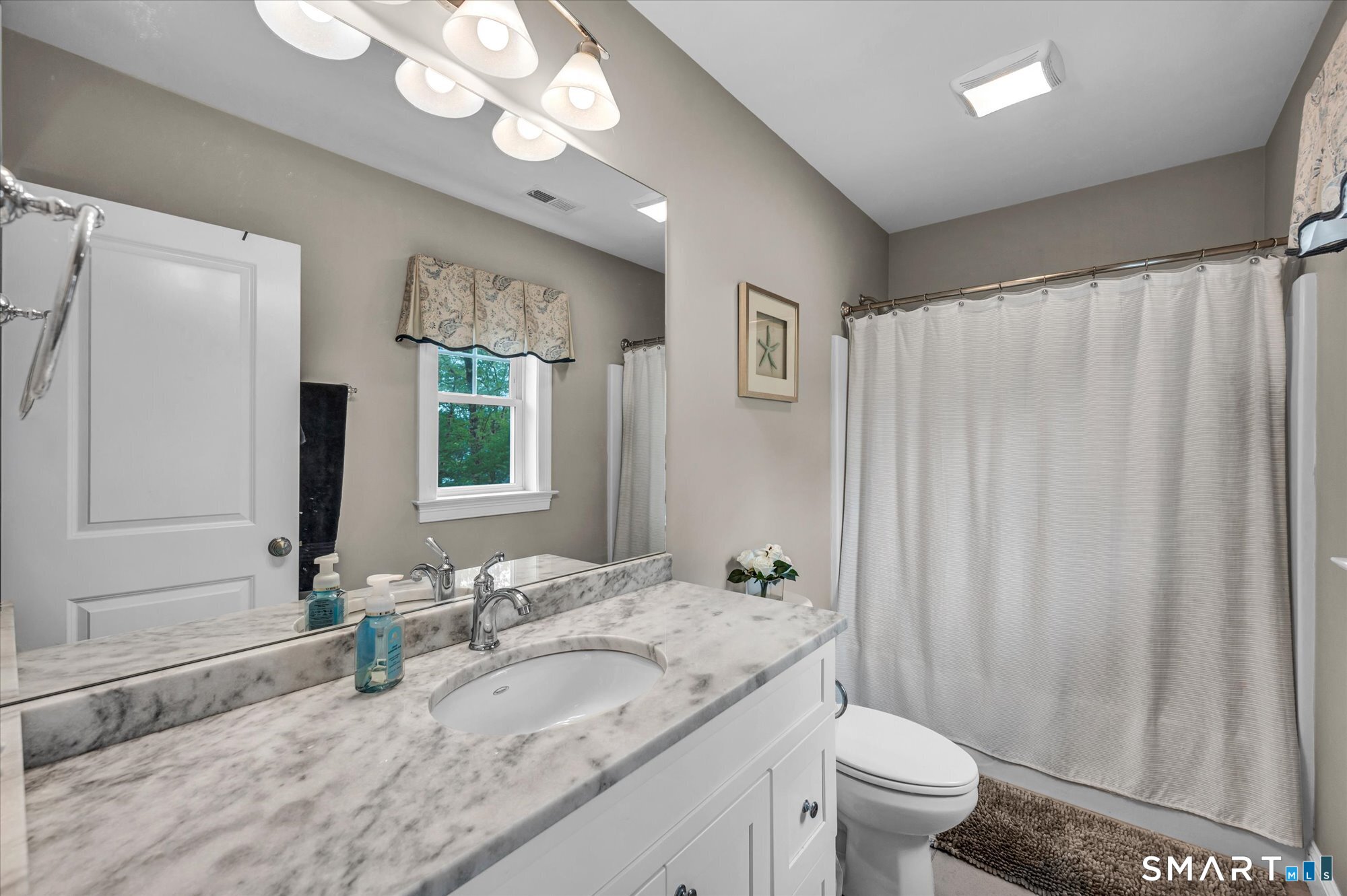 16 Sweetheart Mountain Road Canton, CT 06019 - Photo 28 of 40 a bathroom with a granite countertop sink a toilet and a mirror