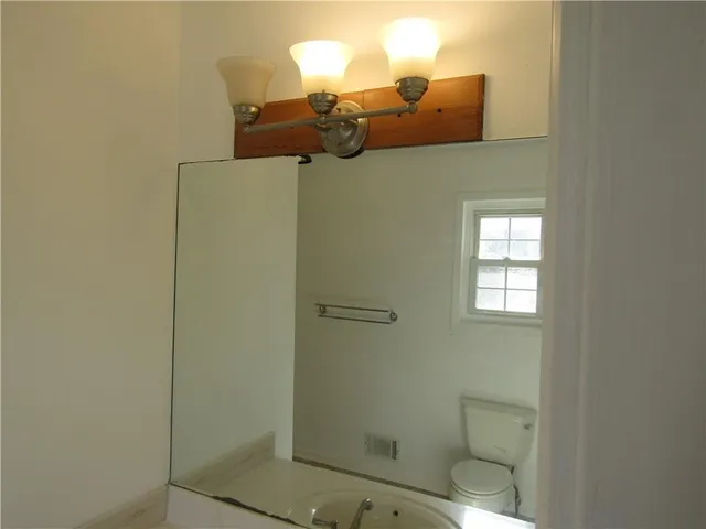 a bathroom with a mirror