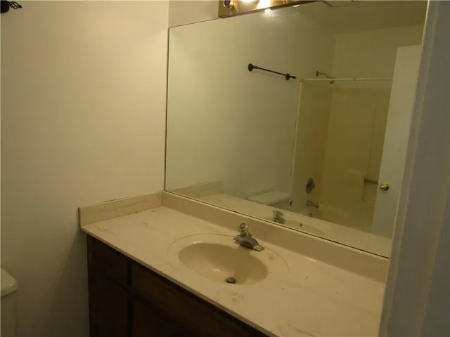 a bathroom with a sink and a shower