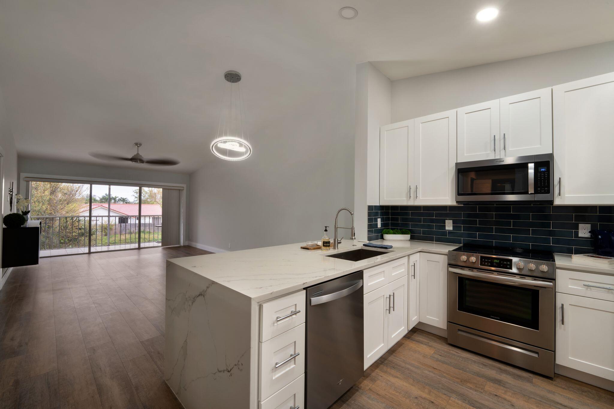 340 Northwest 67th Street, Unit 207 Boca Raton, FL 33487 - Photo 11 of 37 Kitchen/dining/living