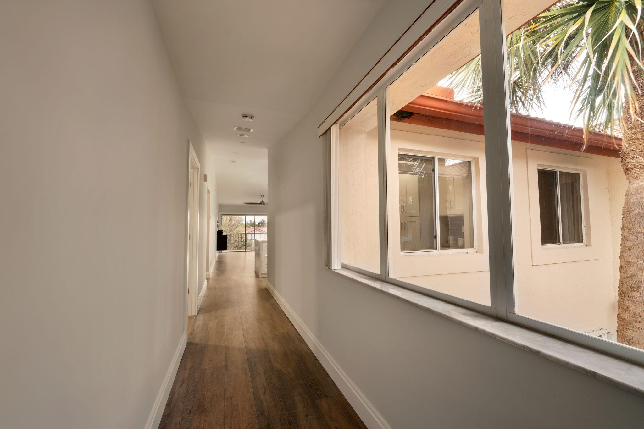 340 Northwest 67th Street, Unit 207 Boca Raton, FL 33487 - Photo 7 of 37 1st hallway