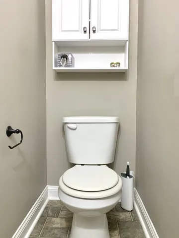 a bathroom with a toilet and a sink