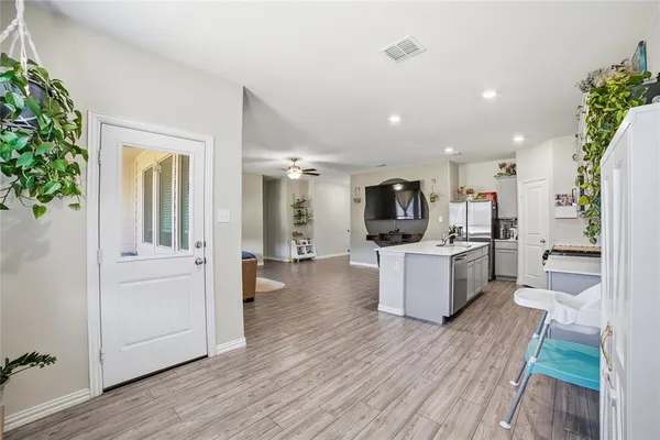 a bedroom with furniture and a flat screen tv