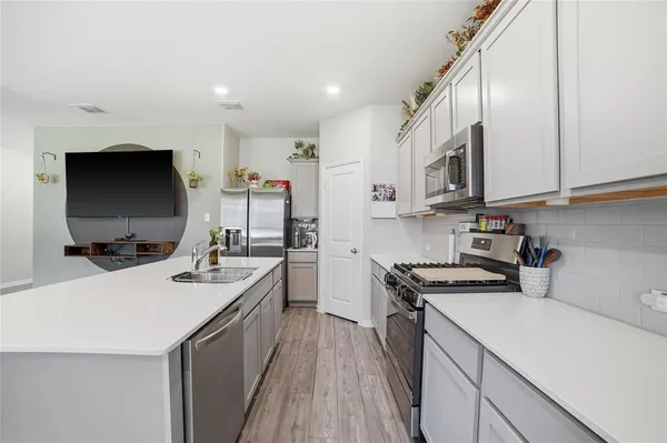 a view of a livingroom with furniture window and wooden floor