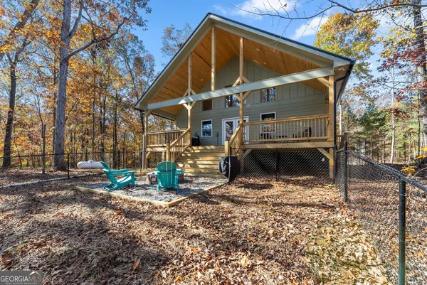 a view of outdoor space with wooden fence