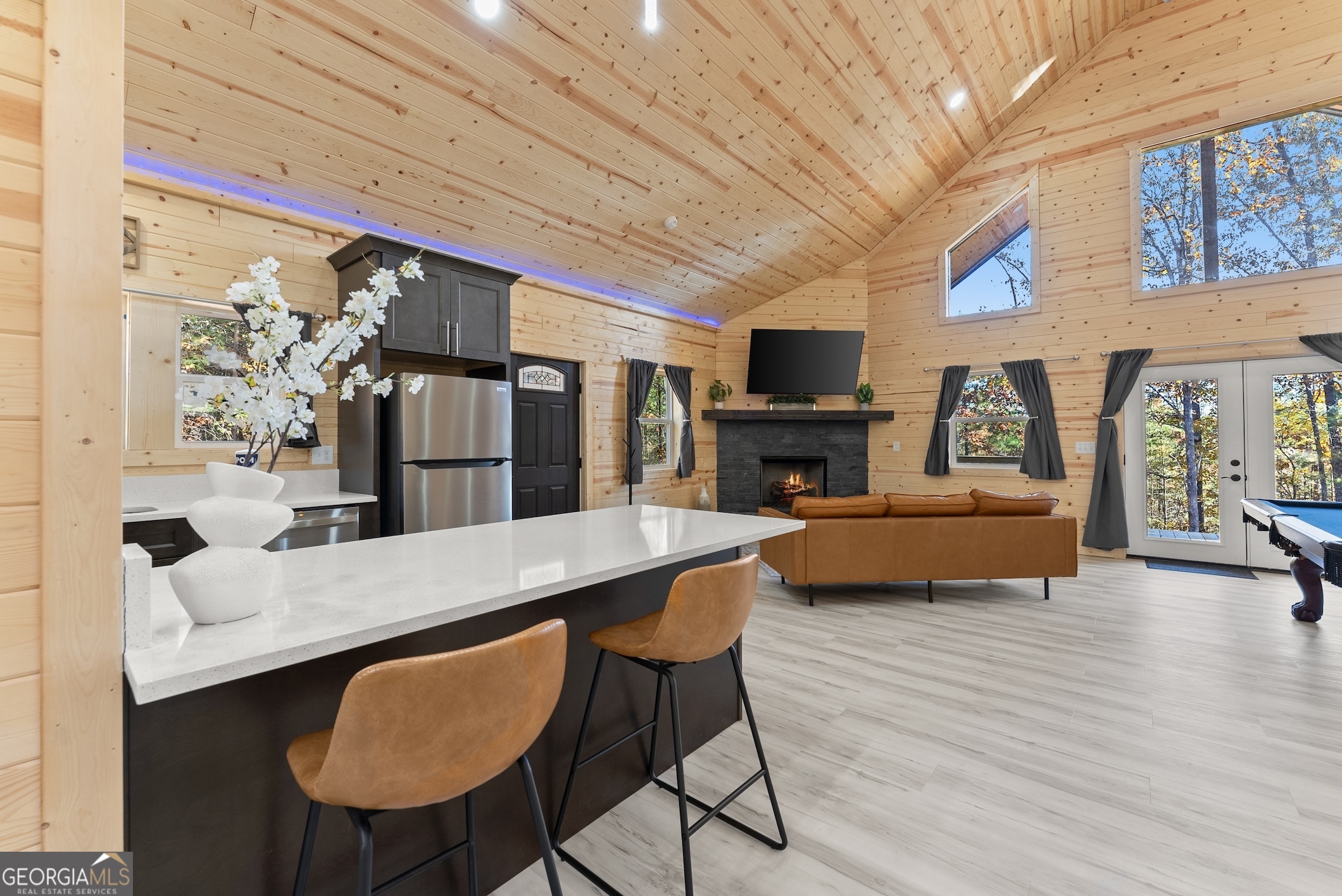 339 Hickory Ridge Drive Cleveland, GA 30528 - Photo 11 of 54 a living room with furniture a fireplace and a flat screen tv