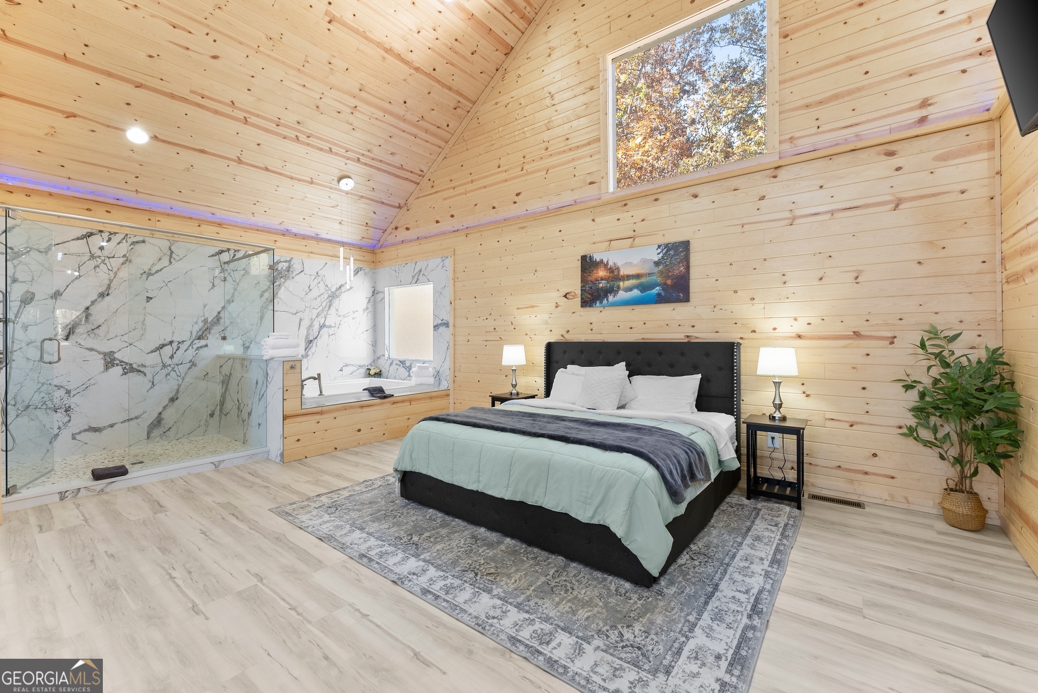 339 Hickory Ridge Drive Cleveland, GA 30528 - Photo 12 of 54 a bedroom with a large bed and a potted plant