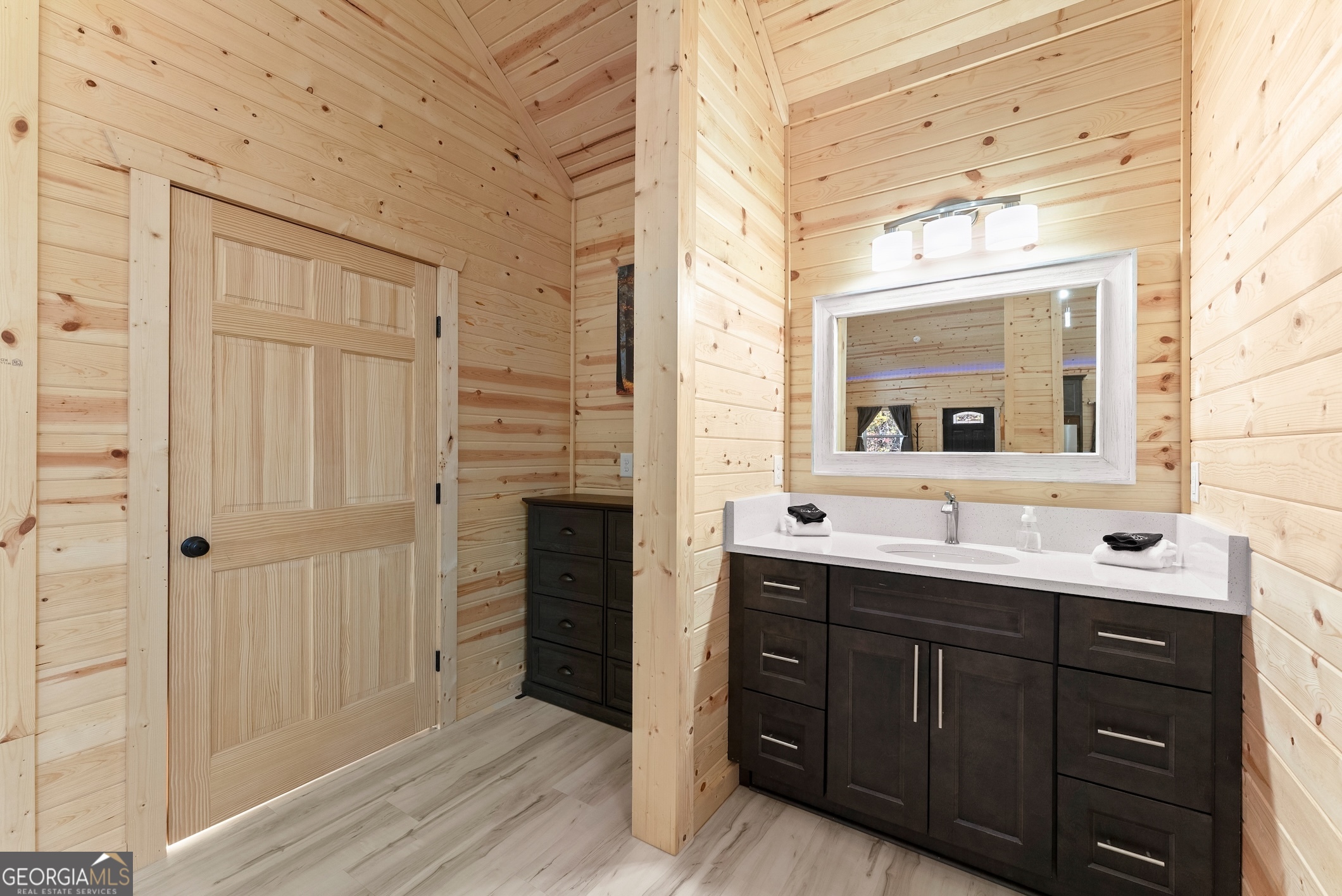 339 Hickory Ridge Drive Cleveland, GA 30528 - Photo 23 of 54 a bathroom with a double vanity sink and mirror