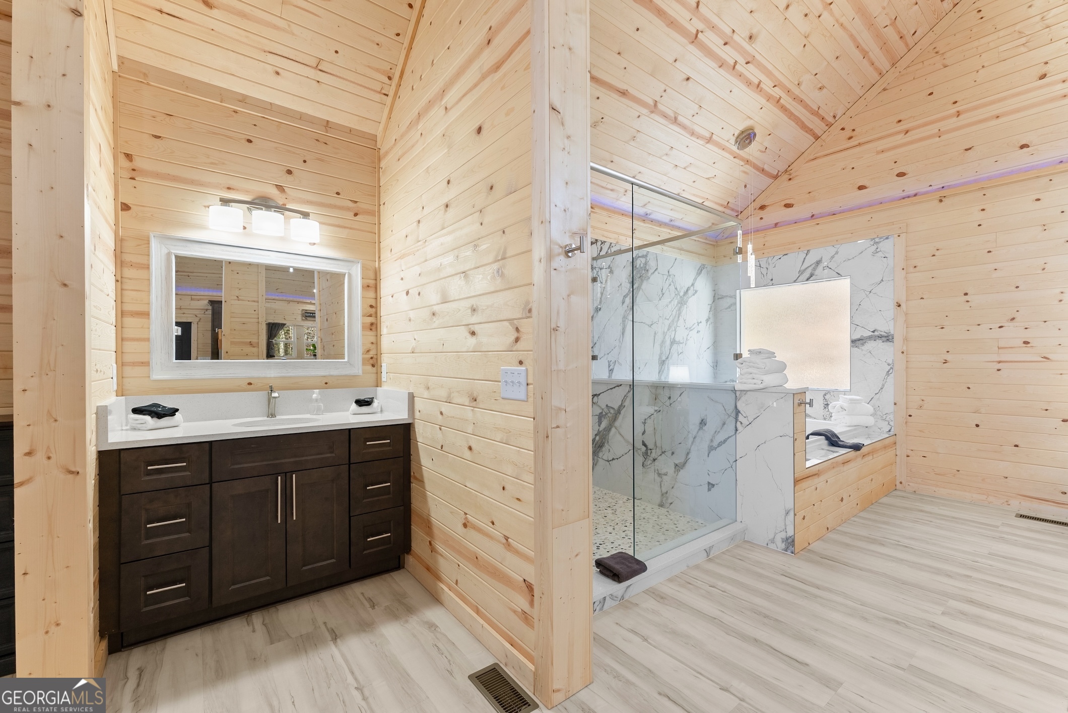 339 Hickory Ridge Drive Cleveland, GA 30528 - Photo 24 of 54 a spacious bathroom with a double vanity sink a mirror and shower