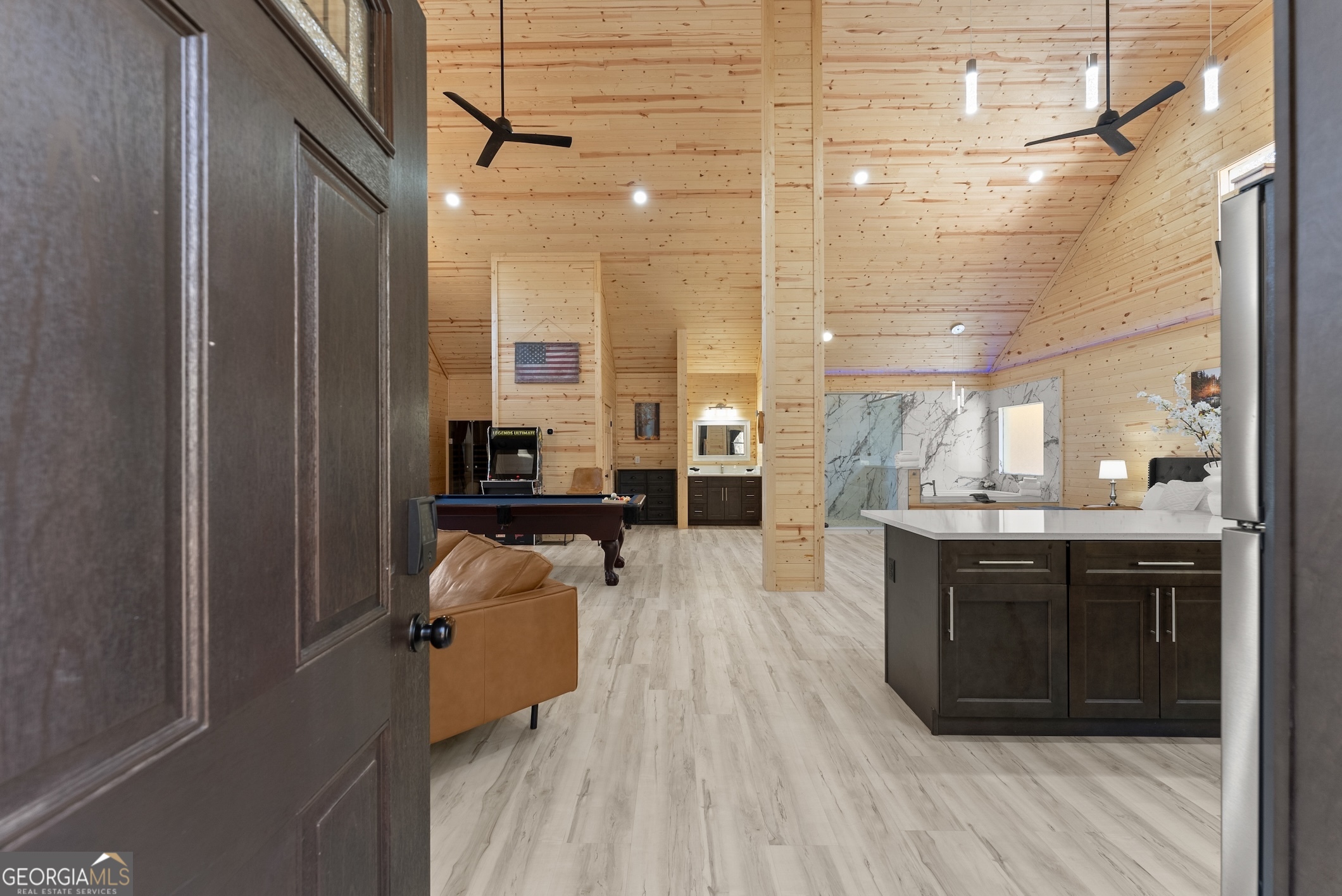 339 Hickory Ridge Drive Cleveland, GA 30528 - Photo 3 of 54 a large kitchen with kitchen island a sink a stove and a wooden floors