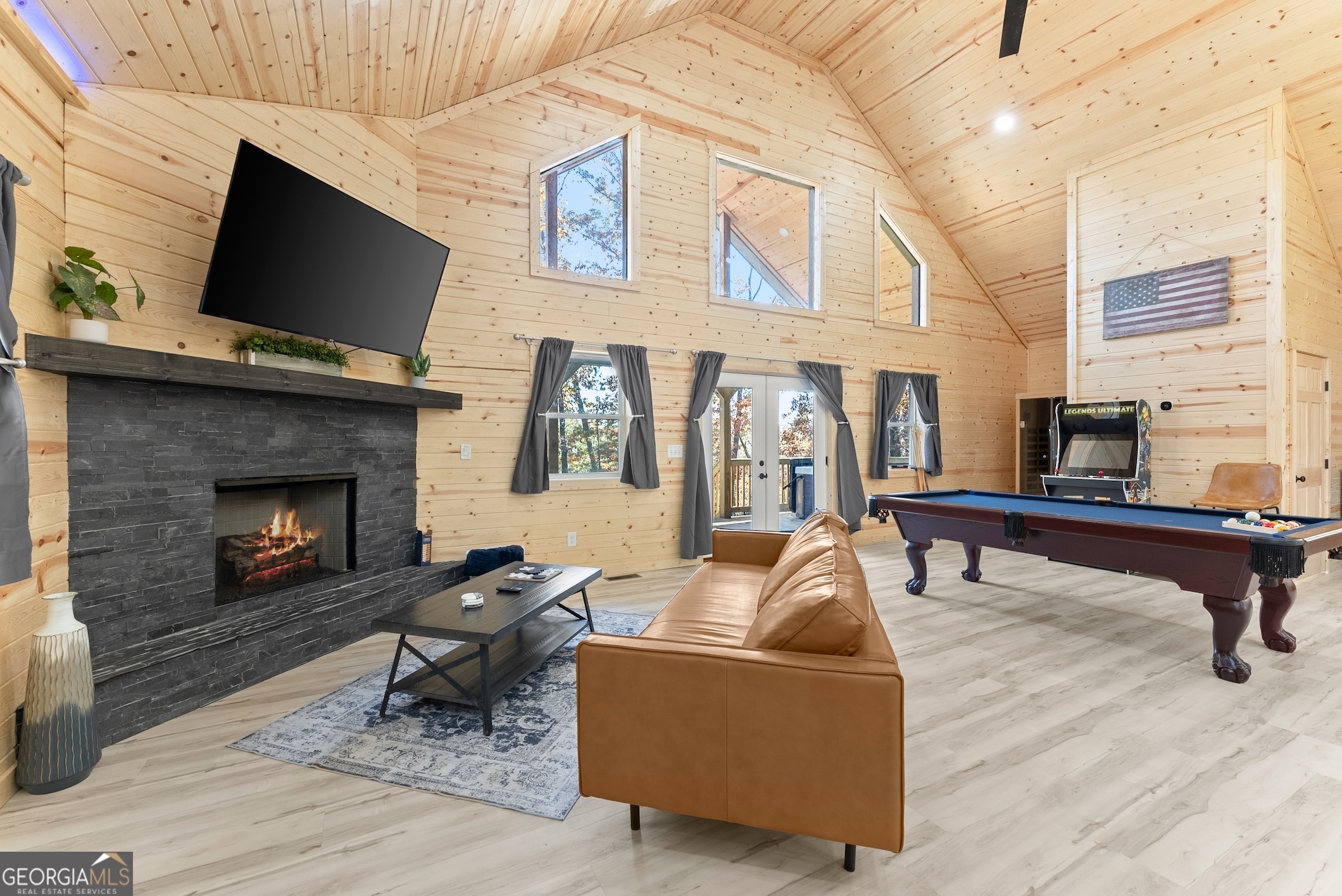 339 Hickory Ridge Drive Cleveland, GA 30528 - Photo 32 of 54 a living room with furniture a flat screen tv and a fireplace
