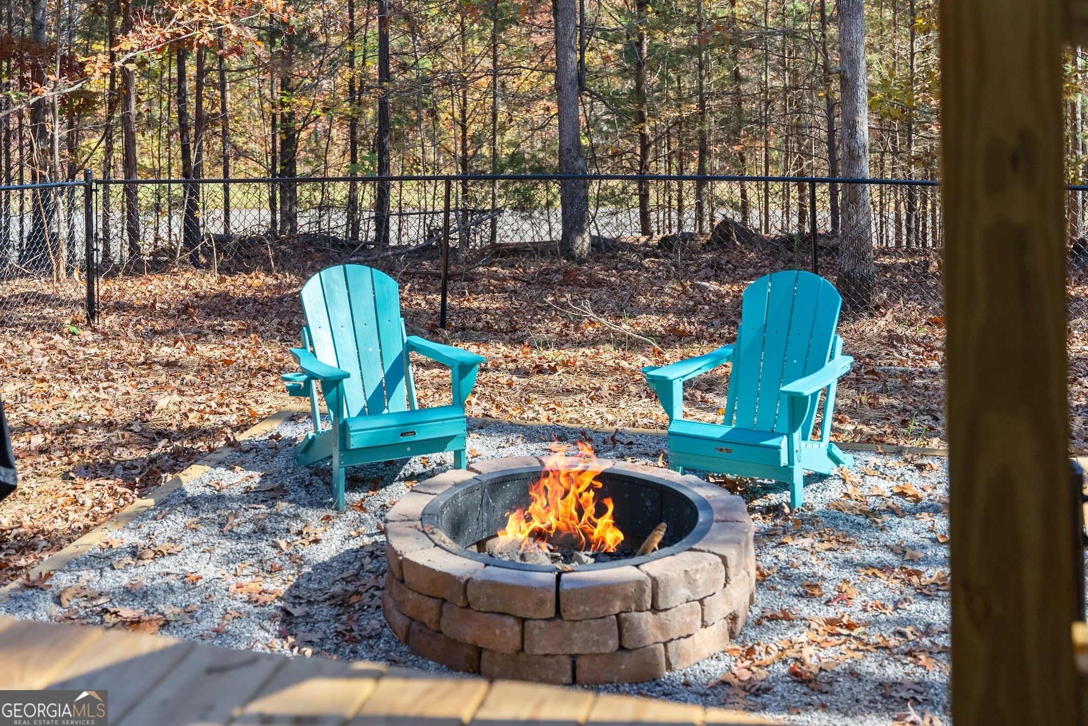 339 Hickory Ridge Drive Cleveland, GA 30528 - Photo 35 of 54 a view of a wooden chairs and fire pit in the outdoor space