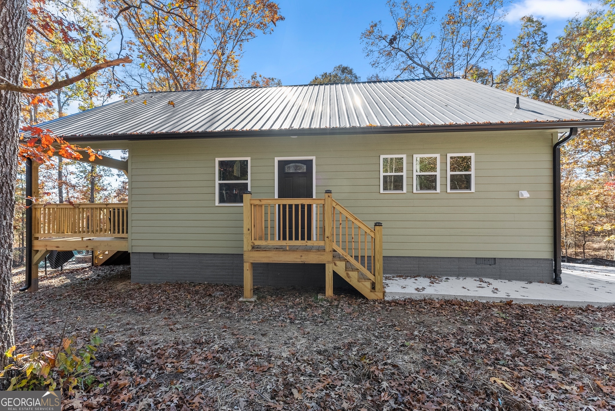 339 Hickory Ridge Drive Cleveland, GA 30528 - Photo 40 of 54 a view of a house with a yard and wooden fence