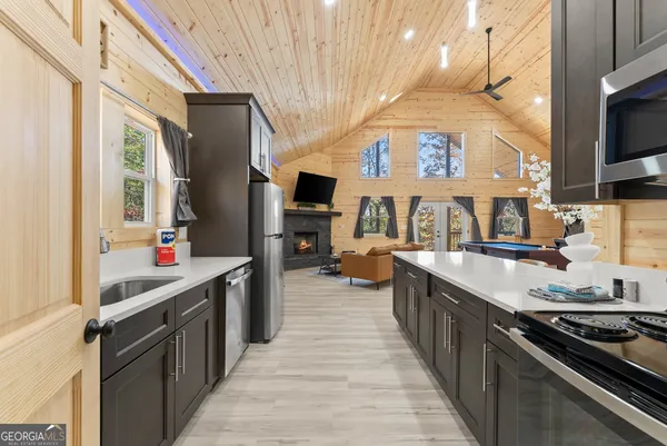 a kitchen with stainless steel appliances a sink and a stove