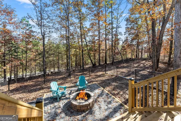 a view of a backyard with a deck and a garden