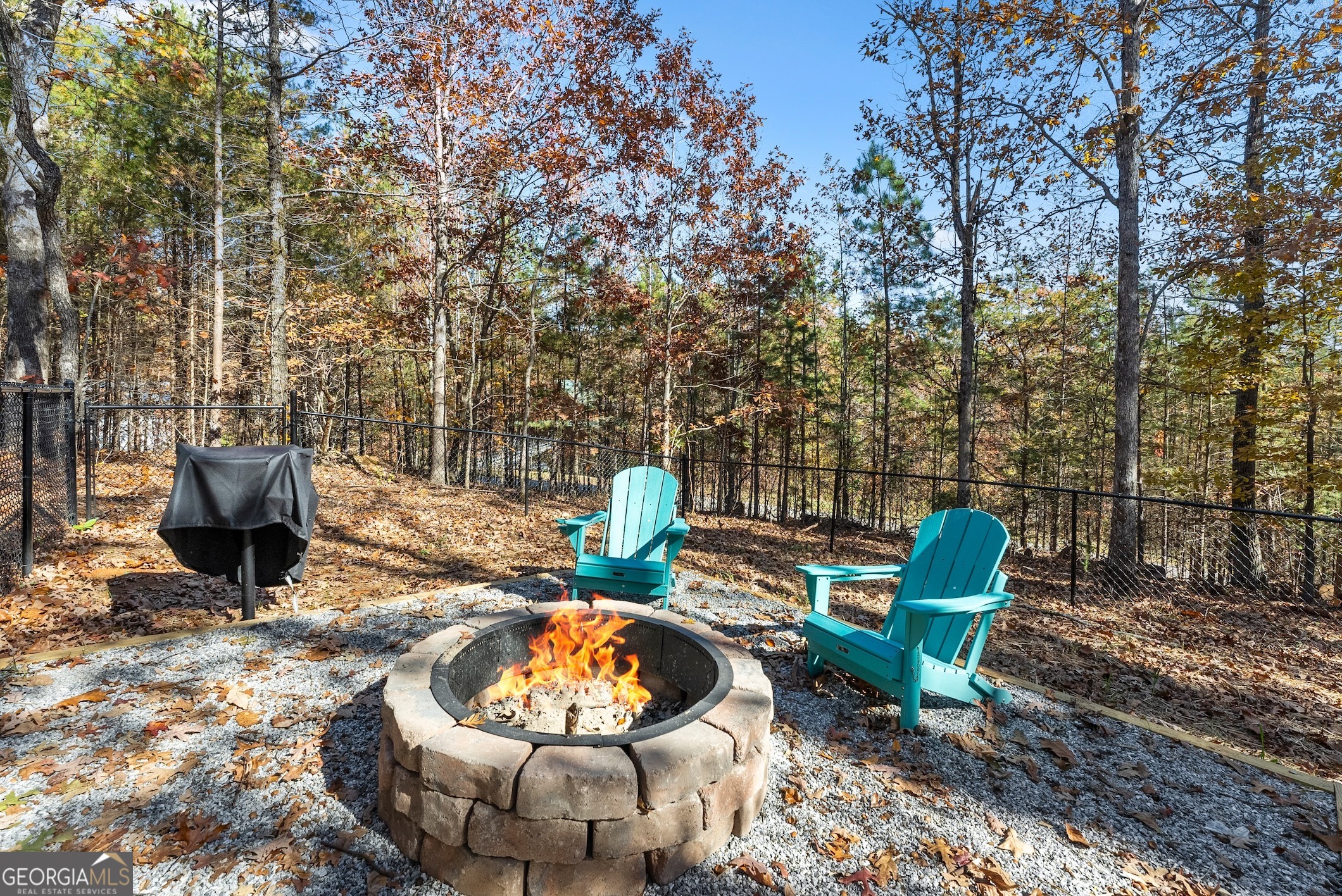 339 Hickory Ridge Drive Cleveland, GA 30528 - Photo 45 of 54 a view of a chairs and fire pit in the back yard