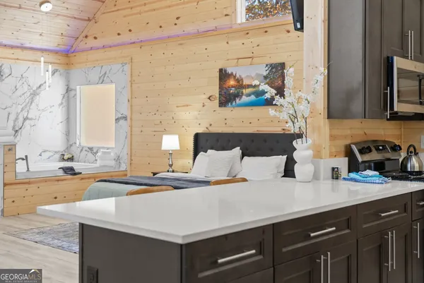 a bedroom with a bed and a dresser