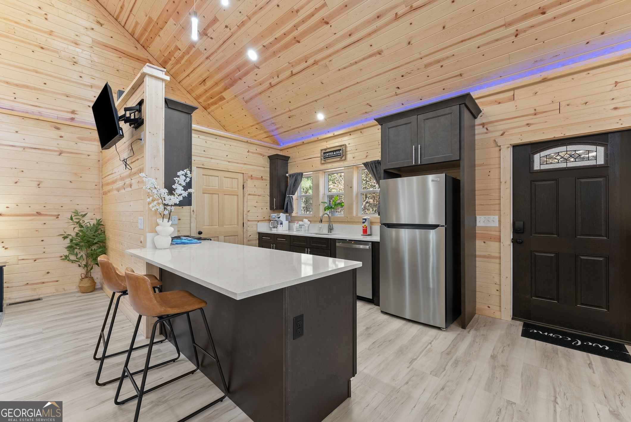 339 Hickory Ridge Drive Cleveland, GA 30528 - Photo 10 of 54 a kitchen with stainless steel appliances kitchen island granite countertop a refrigerator a stove a sink dishwasher with a dining table and chairs