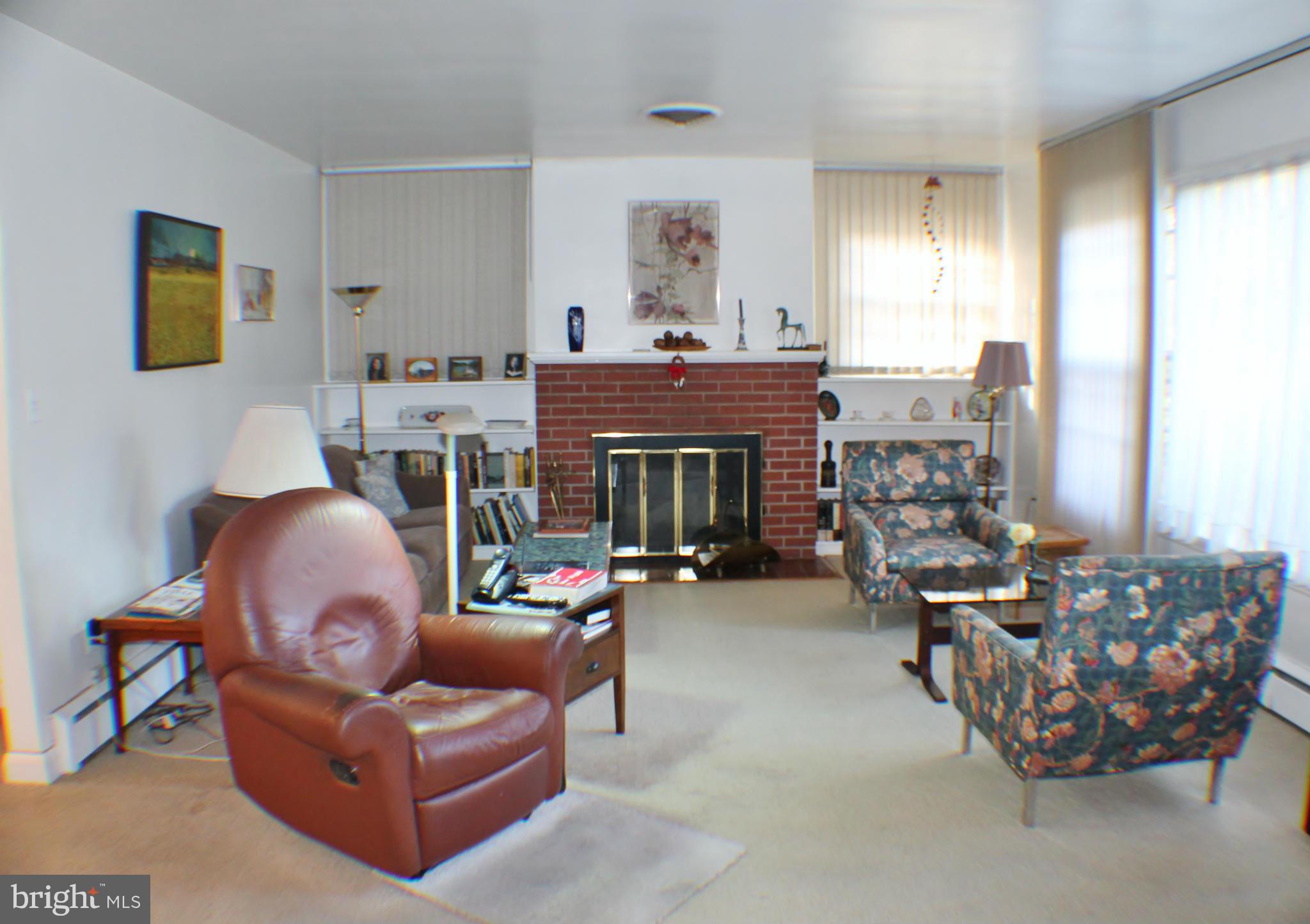 7205 Prince George Road Pikesville, MD 21207 - Photo 3 of 20 a living room with furniture and a fireplace