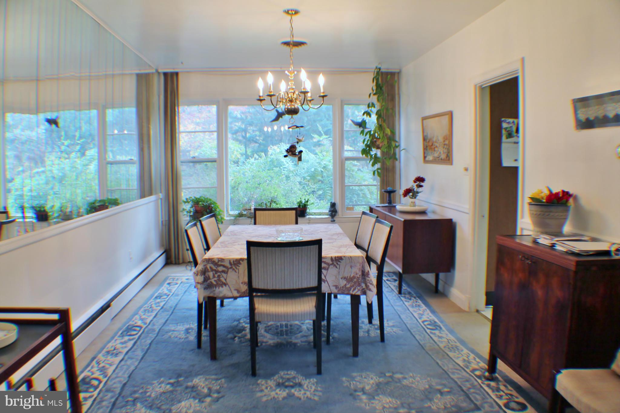 7205 Prince George Road Pikesville, MD 21207 - Photo 5 of 20 a view of a dining room with furniture window and outside view