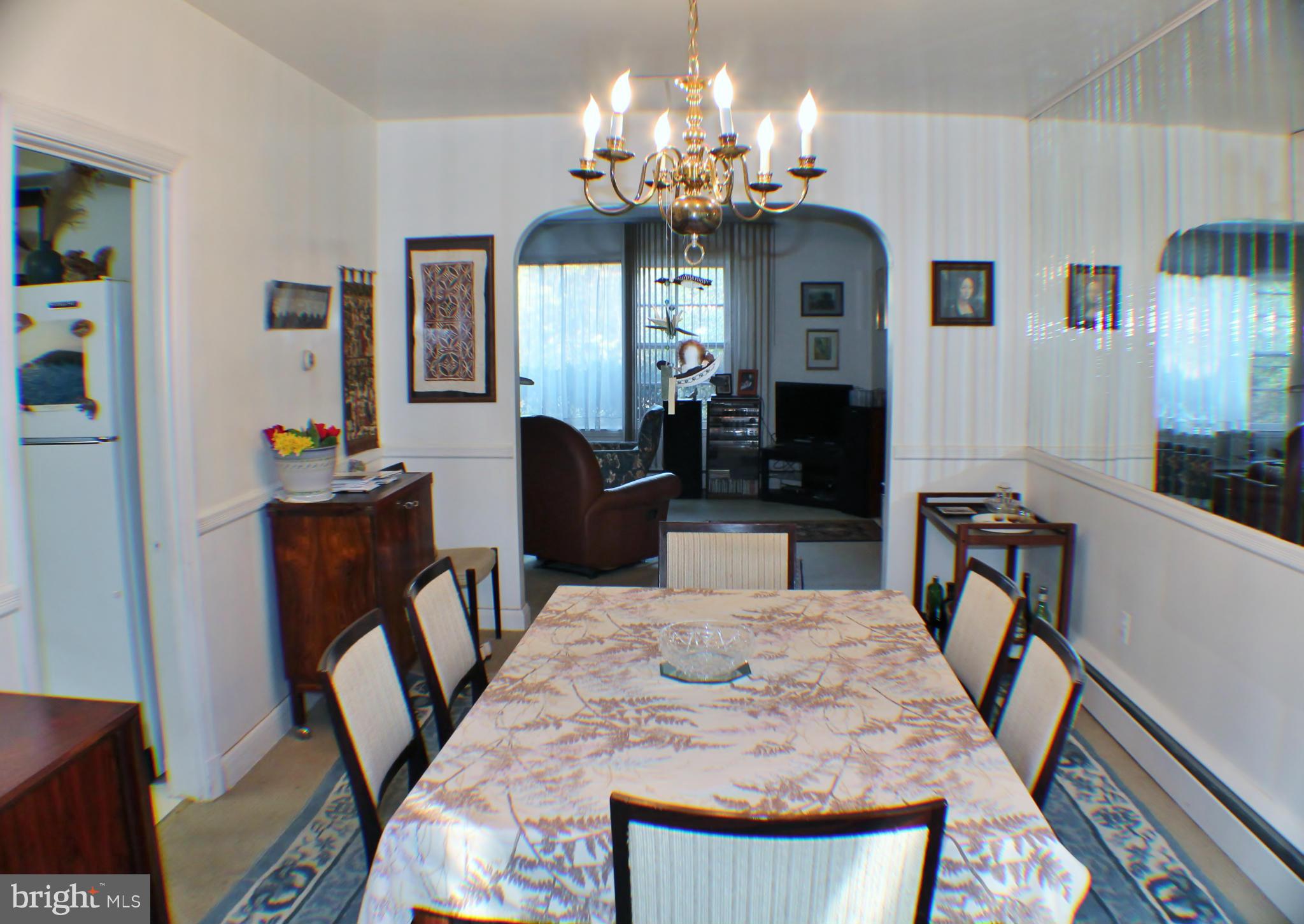 7205 Prince George Road Pikesville, MD 21207 - Photo 6 of 20 a view of a dining room with furniture and chandelier