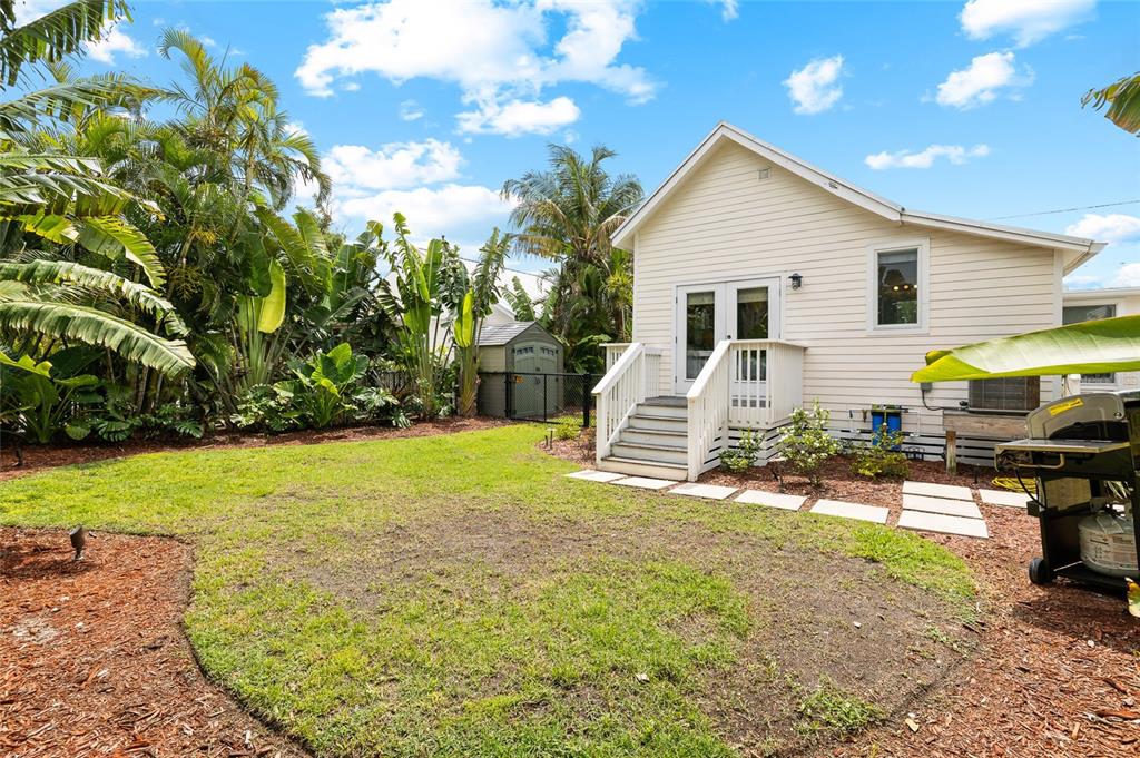 340 Palm Avenue Boca Grande, FL 33921 - Photo 30 of 38 a view of a house with backyard and sitting area
