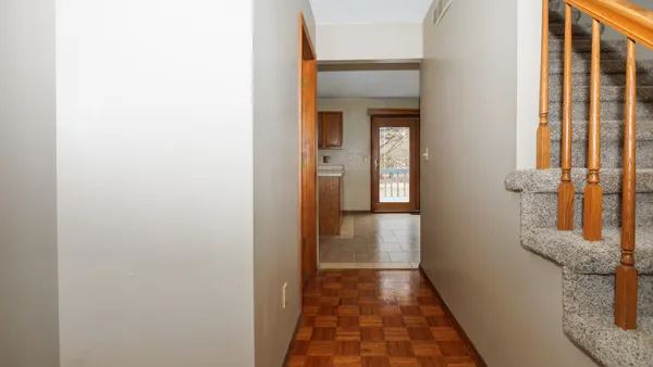 a view of a bathroom from a corridor
