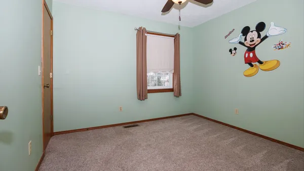 an empty room with a empty space and a window