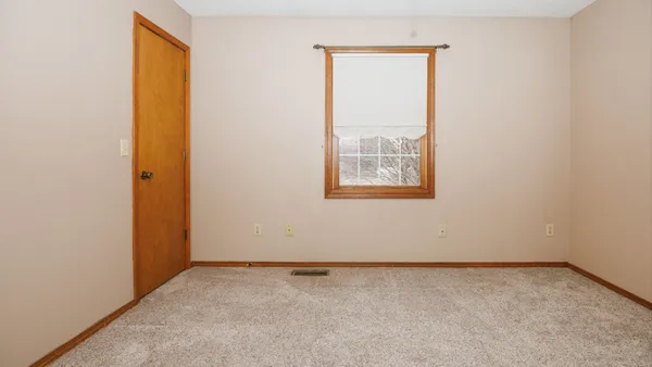 a view of room with a ceiling fan
