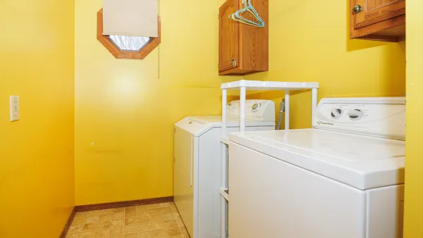 an empty room with a fireplace and painted walls