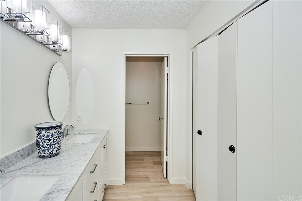 1140 Arcadia Avenue, Unit H Arcadia, CA 91007 - Photo 22 of 46 a living room with furniture and a chandelier
