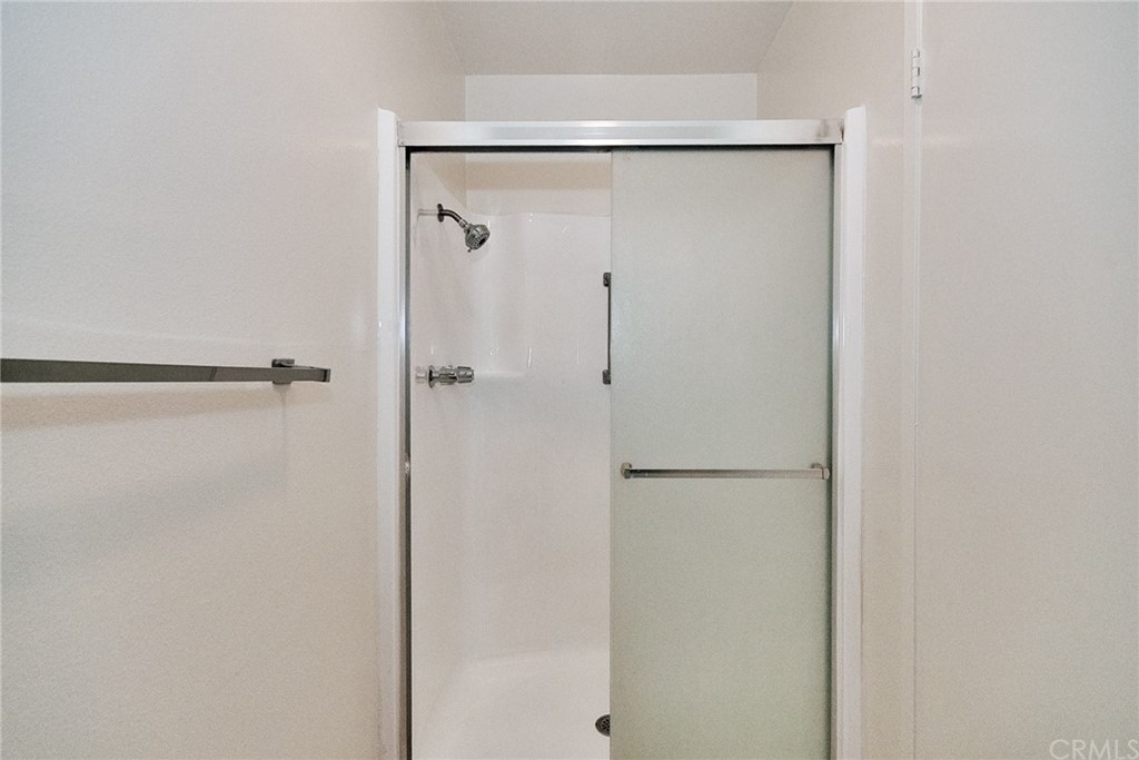 1140 Arcadia Avenue, Unit H Arcadia, CA 91007 - Photo 23 of 46 a bathroom with a glass shower door