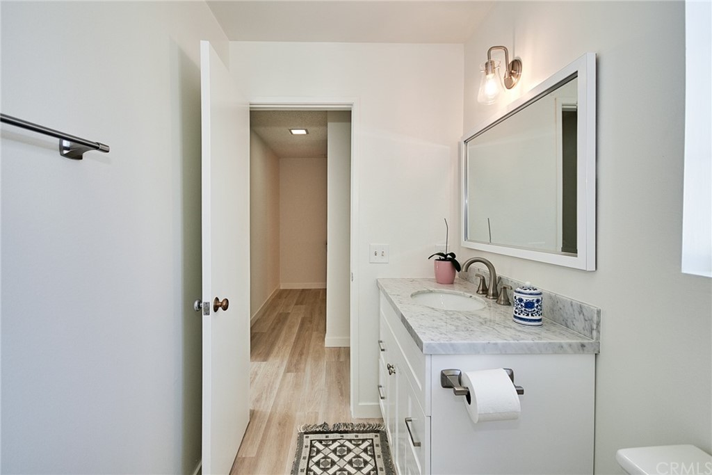 1140 Arcadia Avenue, Unit H Arcadia, CA 91007 - Photo 30 of 46 a bathroom with a sink and a mirror