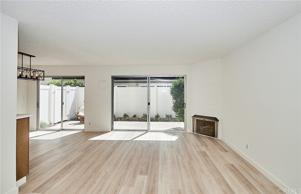 1140 Arcadia Avenue, Unit H Arcadia, CA 91007 - Photo 6 of 46 a view of a livingroom with wooden floor